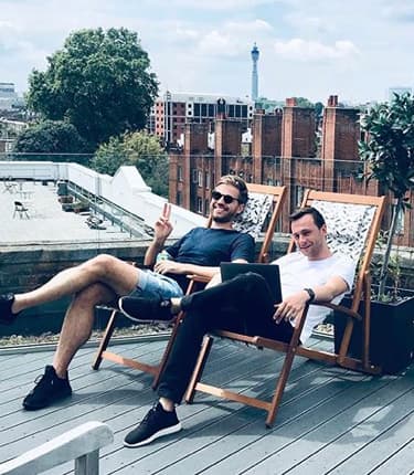 Member of staff relaxing on the balcony